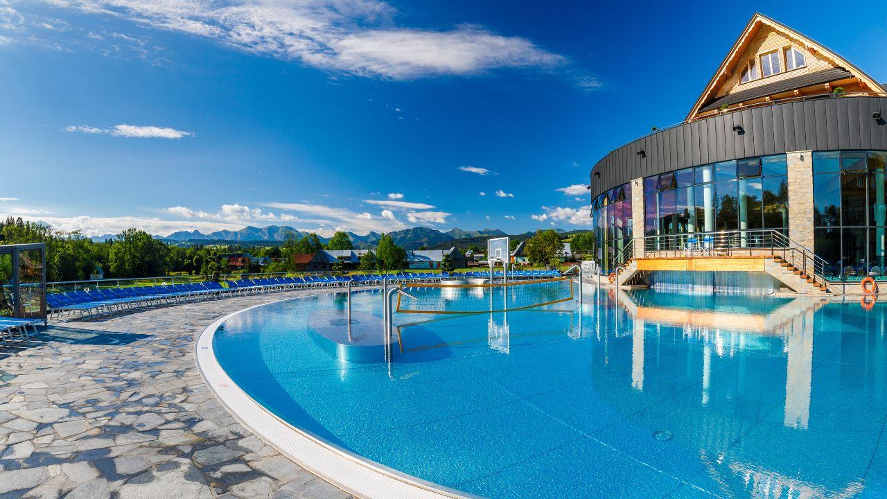 Panoramic view of Chochołowskie Thermal Baths with the Tatra Mountains in the background